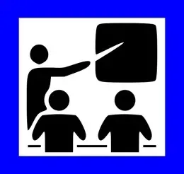 Presenter pointing to information on a whiteboard during a presentation.