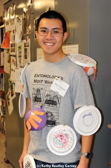UC Davis entomology major Alex Nguyen, a third-year student, gets