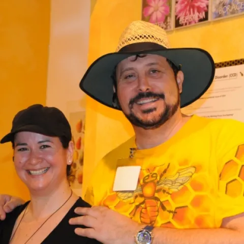 Karen Flores and Dennis Price: The bees have their attention and their respect. (Photo by Kathy Keatley Garvey)