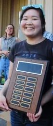 Ivana Li with plaque. In back is bee breeder-geneticist Susan Cobey. (Photo by Kathy Keatley Garvey)