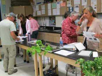 People in a classroom learning about gardening
