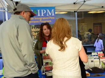 Associate director Karey Windbiel-Rojas of UC IPM answers a question at UC Davis Picnic Day. (Photo by Kathy Keatley Garvey)